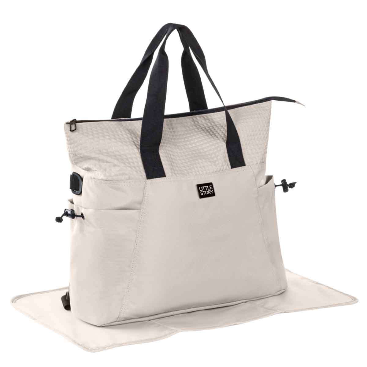 ليتل ستوري حقيبة حفاضات للأم باللون البيج مع سجادة تغيير