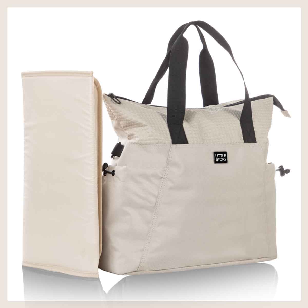 ليتل ستوري حقيبة حفاضات للأم باللون البيج مع سجادة تغيير